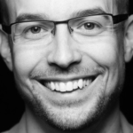 Black and white headshot of Eric Shalley
