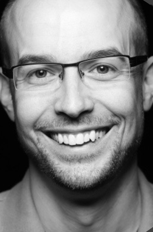 Black and white headshot of Eric Shalley